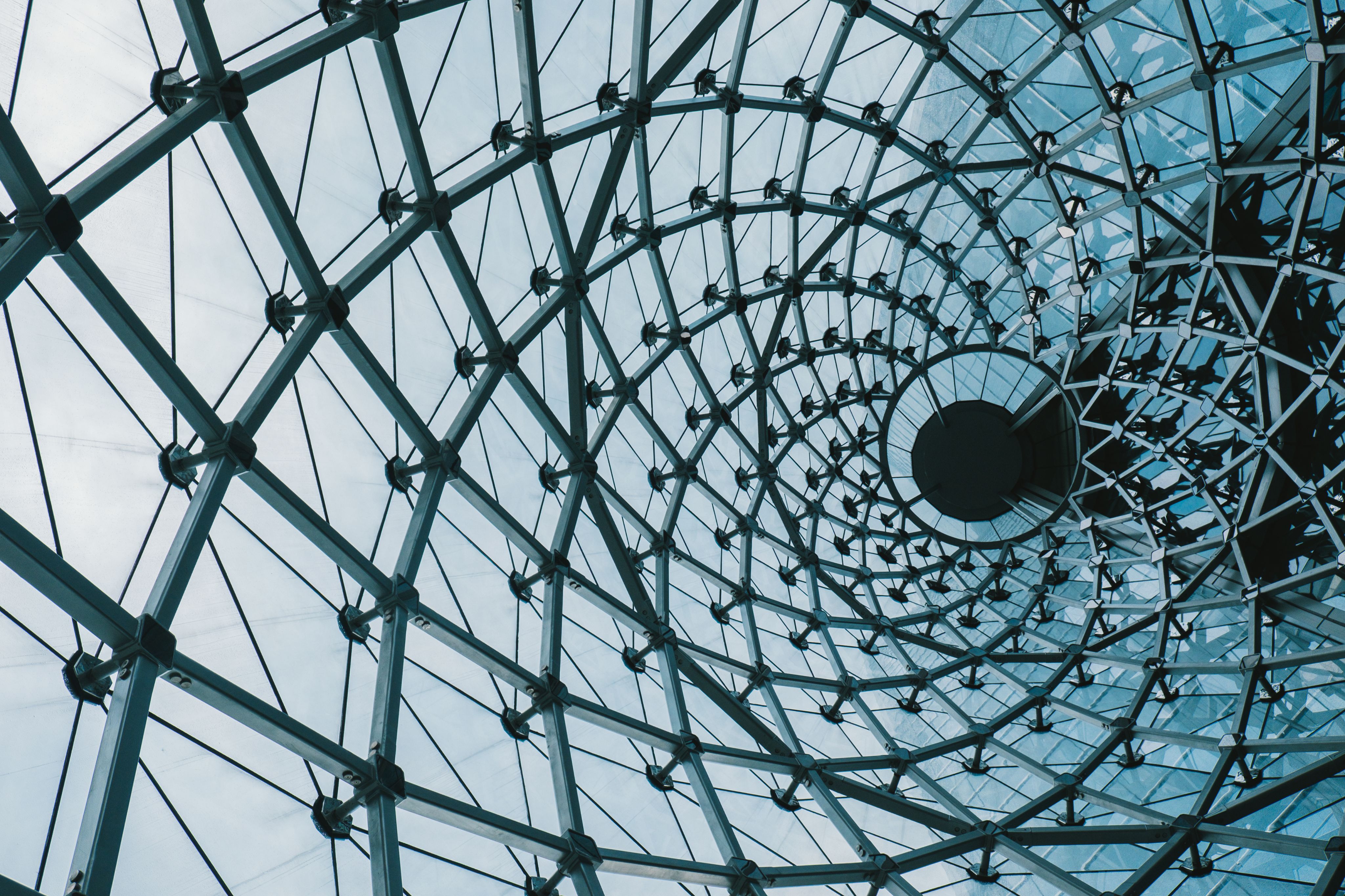 A steel and glass lattice structure in a building. 